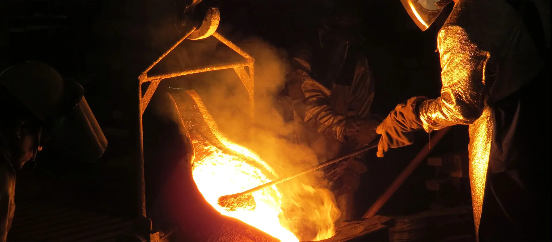 Workers doing liquid molten work